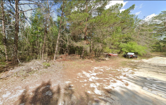 Twin Lakes Blvd. 146 SE 5th St. Lot on a Gravel Road! by L of G.